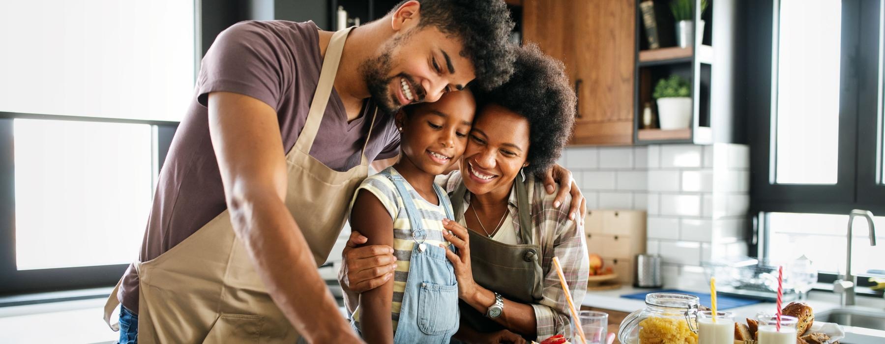 a man and a woman and a child preparing food