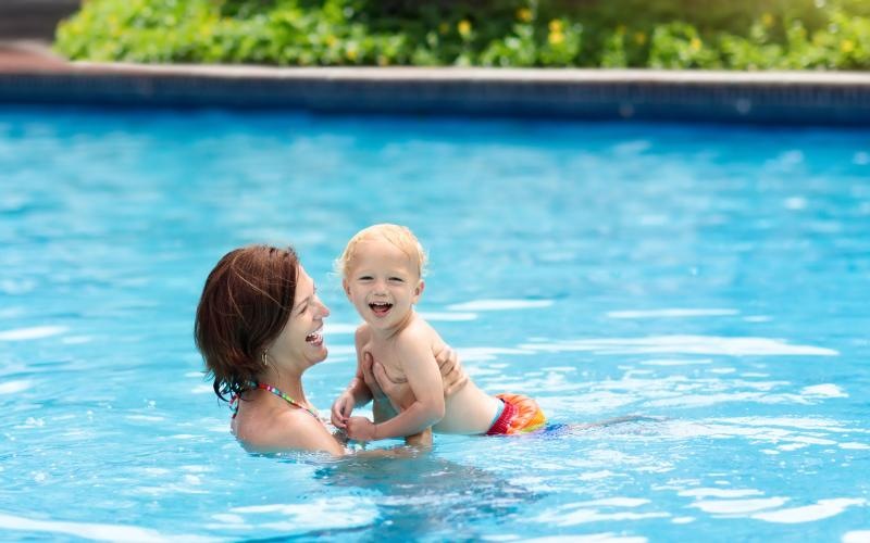 a person and a child in a pool